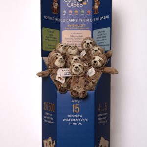 a branded blue collection bin with teddies